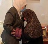 Ramallah Governor Laila Ghannam embraces mother of terrorist killers, passing on her "blessings" to the families of murderers