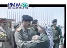 Fatah boasts that Yasser Arafat embraced Saddam Hussein during his 1989 visit