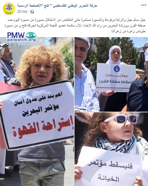 Girls hold signs against Bahrain Conference at demonstration in Ramallah