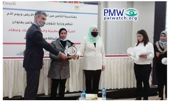 At Women's day event, Canadian government representative awards a plaque to a woman featuring the Palestinian Authority map of 'Palestine' which completely erases Israel